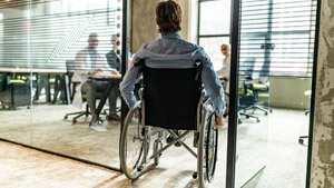 A person in a wheelchair Description automatically generated