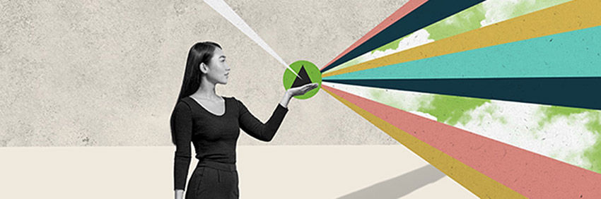 a woman holding a solid black triangle, palm up in her left hand, with multi-colored bands of color emanating from the triangle away from her and a green map in the background